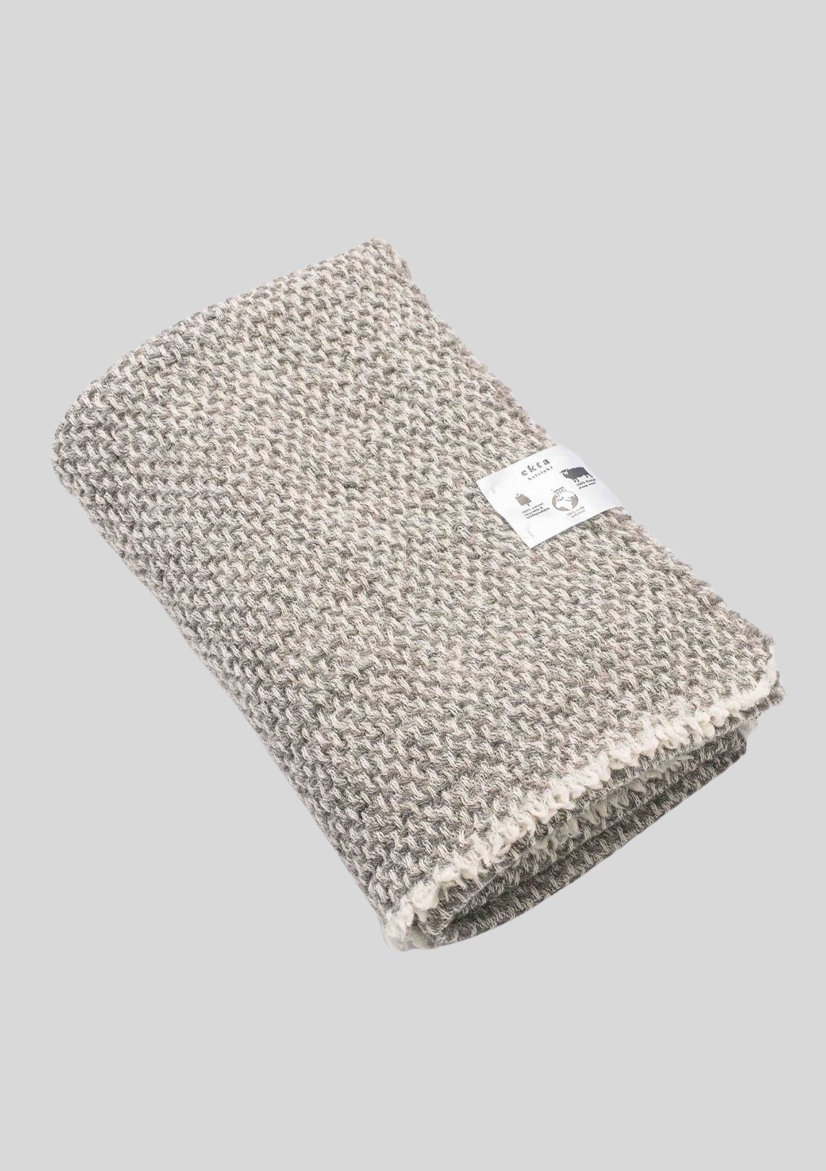 Textured pattern white and grey colored throw made out of responsible Finnish sheep wool. Manufactured in Finland. 