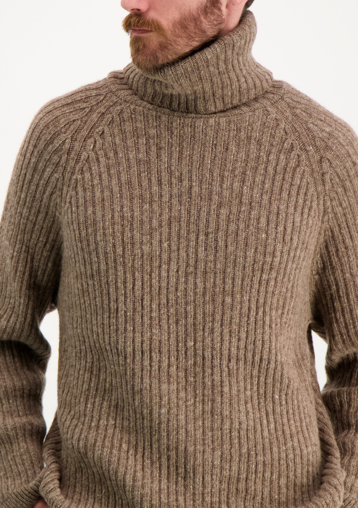 Ribbed beige polo made from Finnish durable sheep wool. Sustainable and warm wool knit made in Finland. 