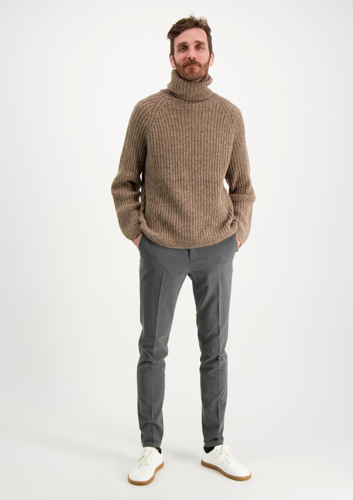 Ribbed beige polo made from Finnish durable sheep wool. Sustainable and warm wool knit made in Finland. 