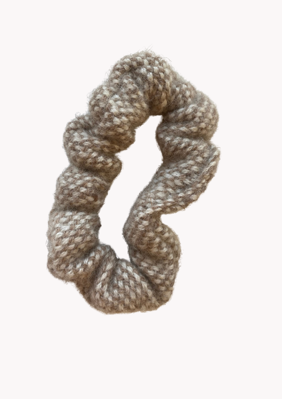 A wool scrunchie that is gentle and warm for the hair and head. Made in Helsinki, material Finnish sheep wool. Comes in beige and brown. 