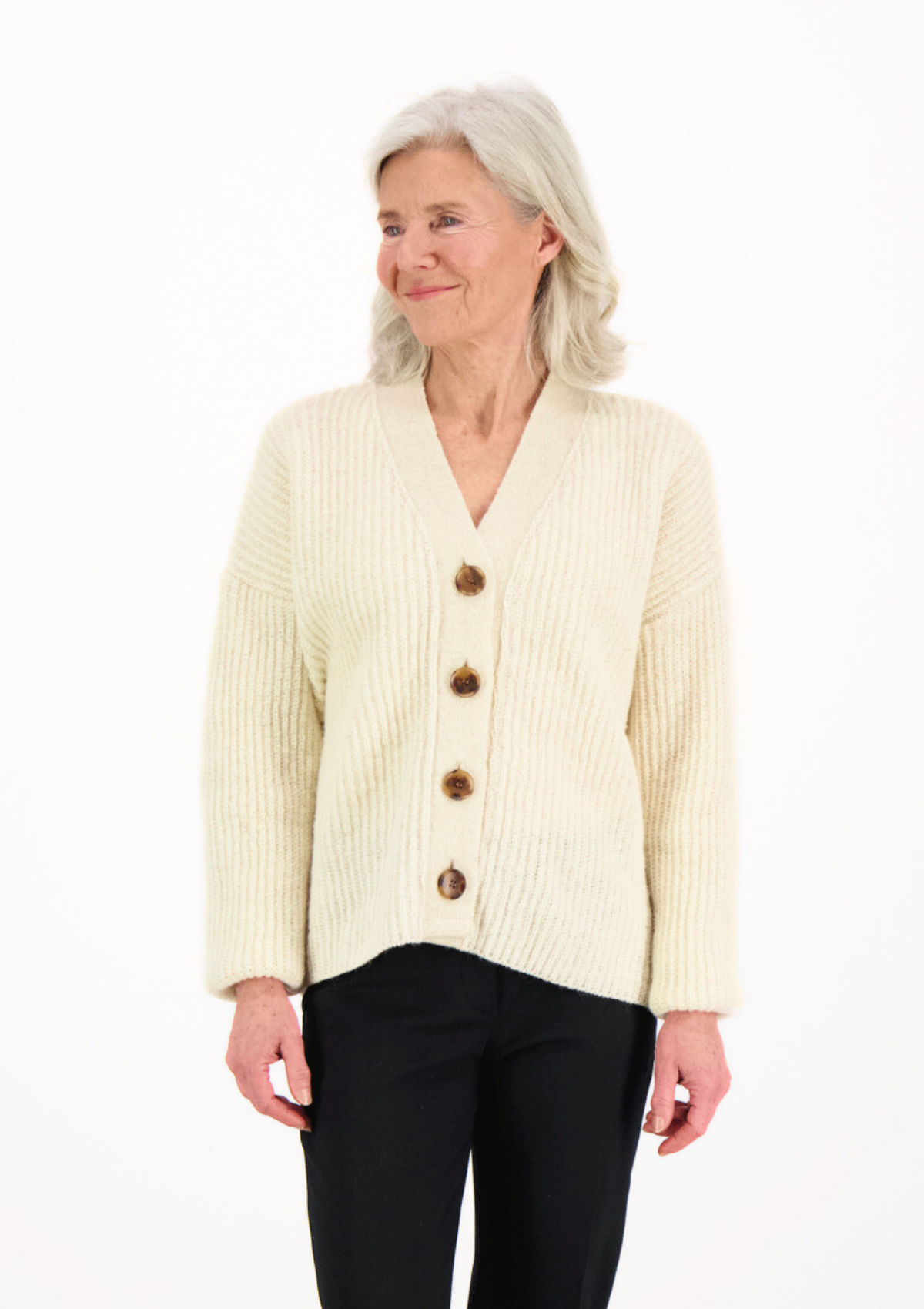 White ribbed cardigan made in Finland from Finnish sheep wool. Sustainable and ethical