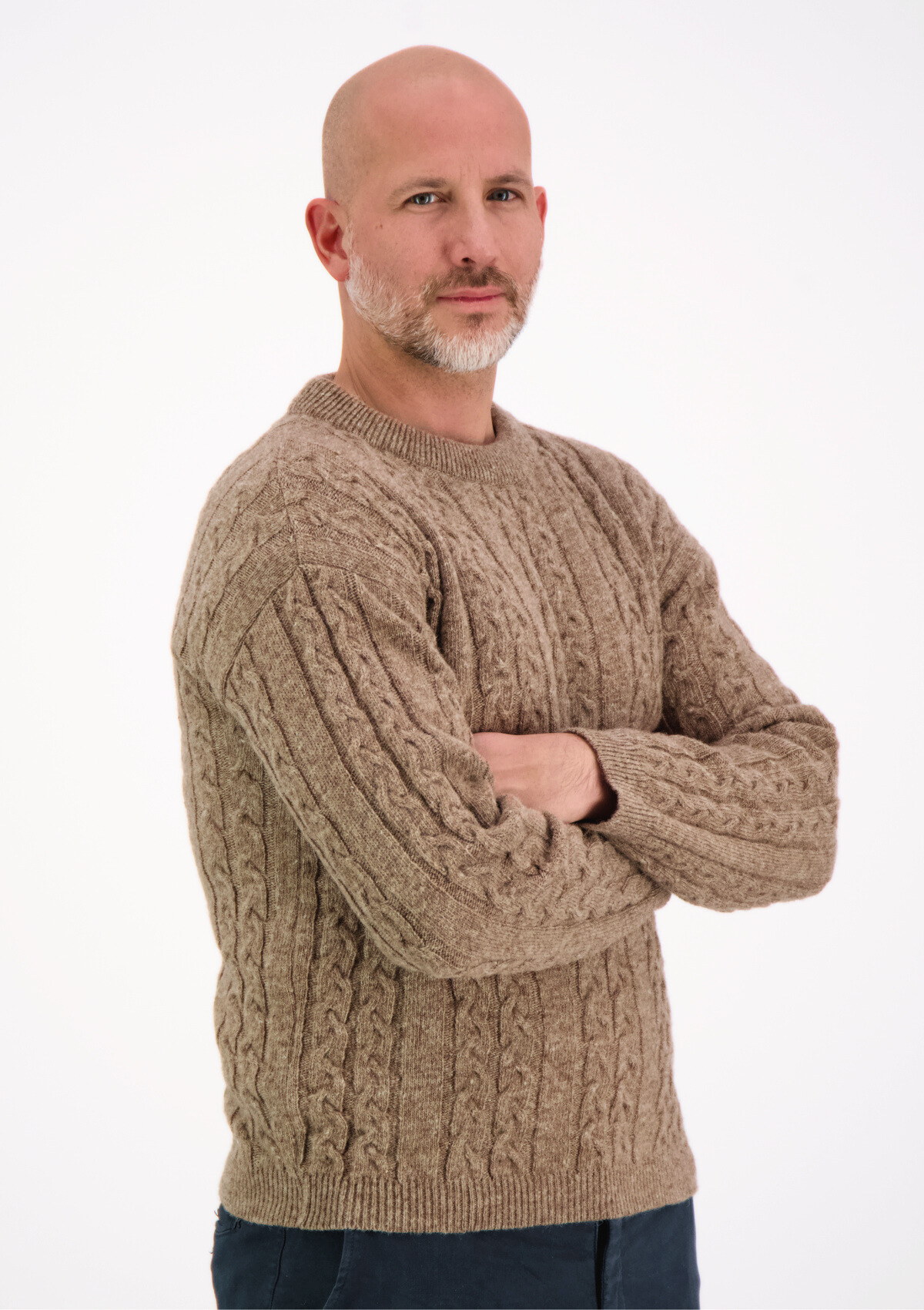 Soft and elegant cable knit in beige with o-neck. Made of responsible Finnish sheep wool in Finland. 