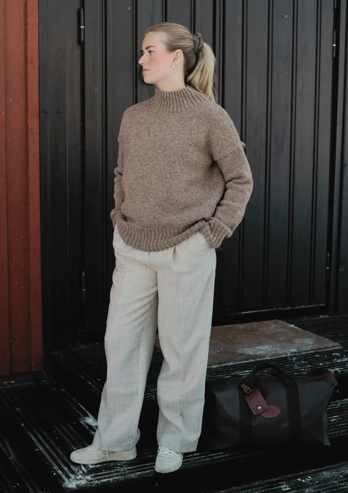 Beige responsible funnel-neck knit made out of Finnish sheep wool, manufactured in Finland.