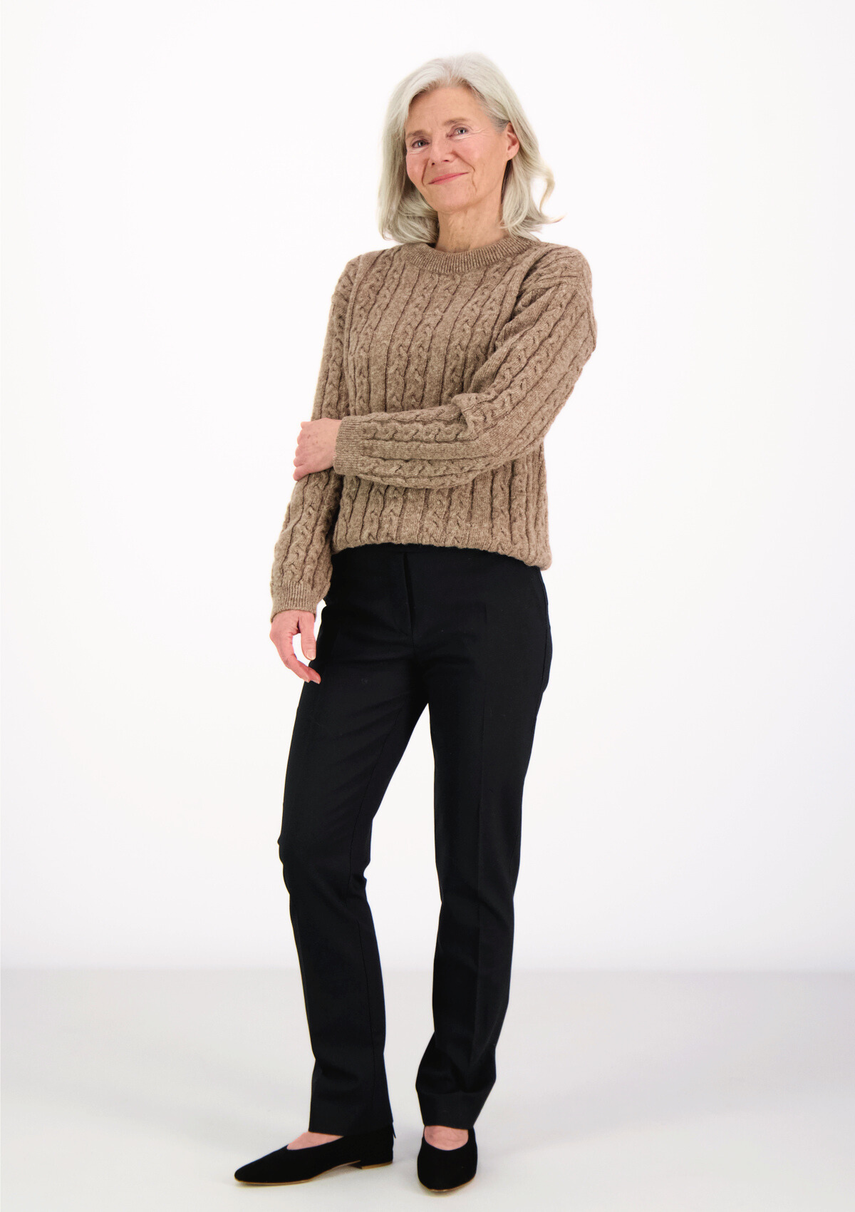 Soft and elegant cable knit in beige with o-neck. Made of responsible Finnish sheep wool in Finland. 